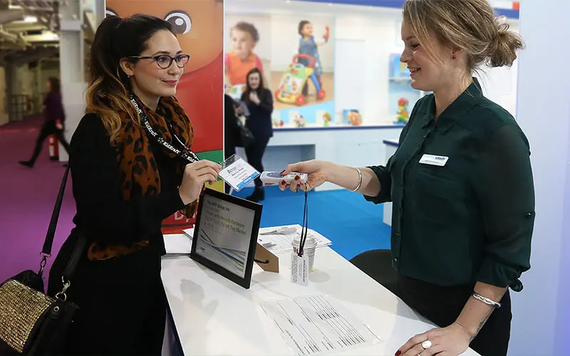 Person scanning a lead on exhibition stand