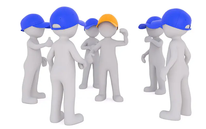 Workers standing around a supervisor