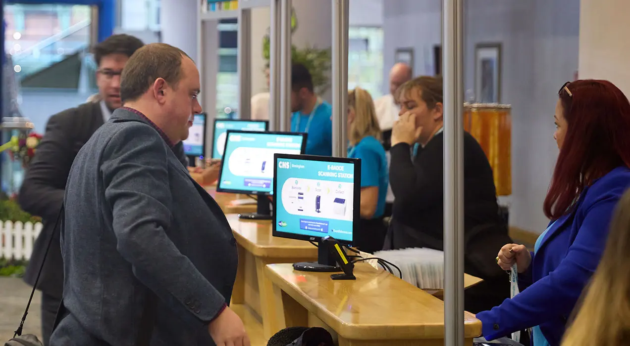 people at registration desk