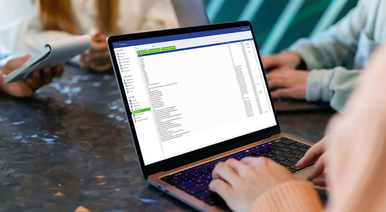 Person in a meeting using EventReference on a laptop