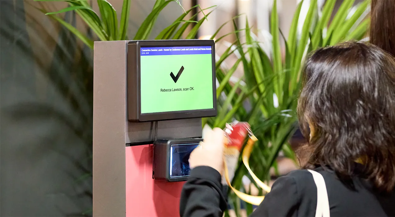 People scanning their badges at a ScanPod